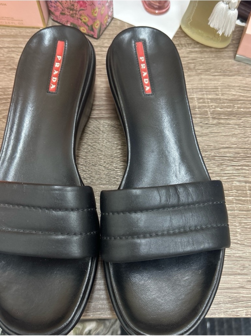 Prada Black Leather Padded Strap Slide Sandals with Red Logo